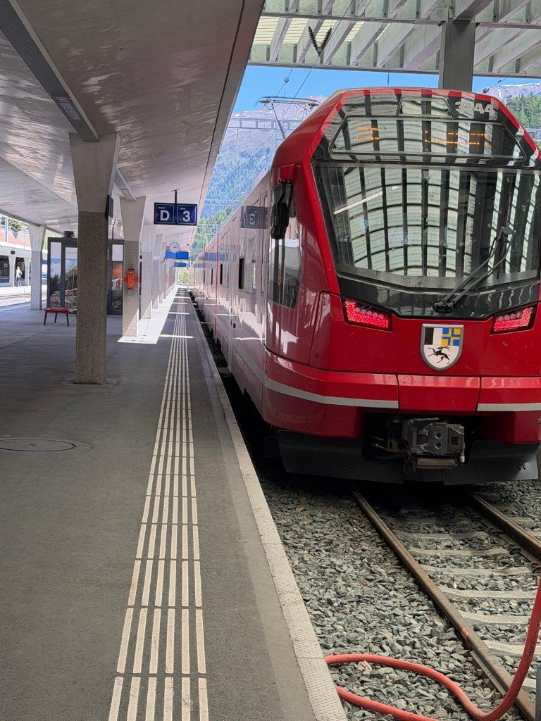 Red mountain train at station