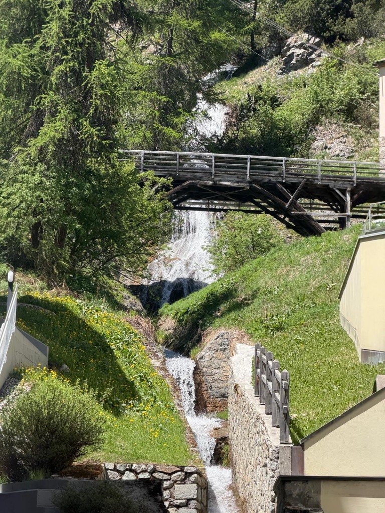 Waterfall and bridge in alpine town